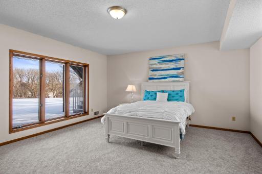 The lower level is home to the fourth and fifth bedrooms and full bathroom.