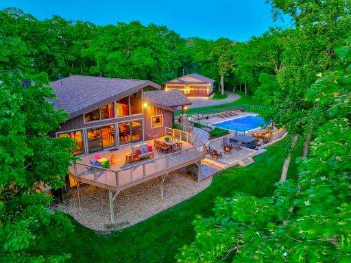 The outdoor amenities continue with a cozy firepit, heated pool, expansive patio & walkout deck, generous yard, and a massive 40x40 shed with loft storageâideal for storing toys, gear, or diving into your favorite hobbies.