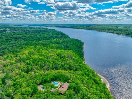 Nestled on a premier stretch of shoreline with one of the best sandy beaches on the river, this stunning estate offers the river lifestyle of your dreams! 300ft of shoreline.