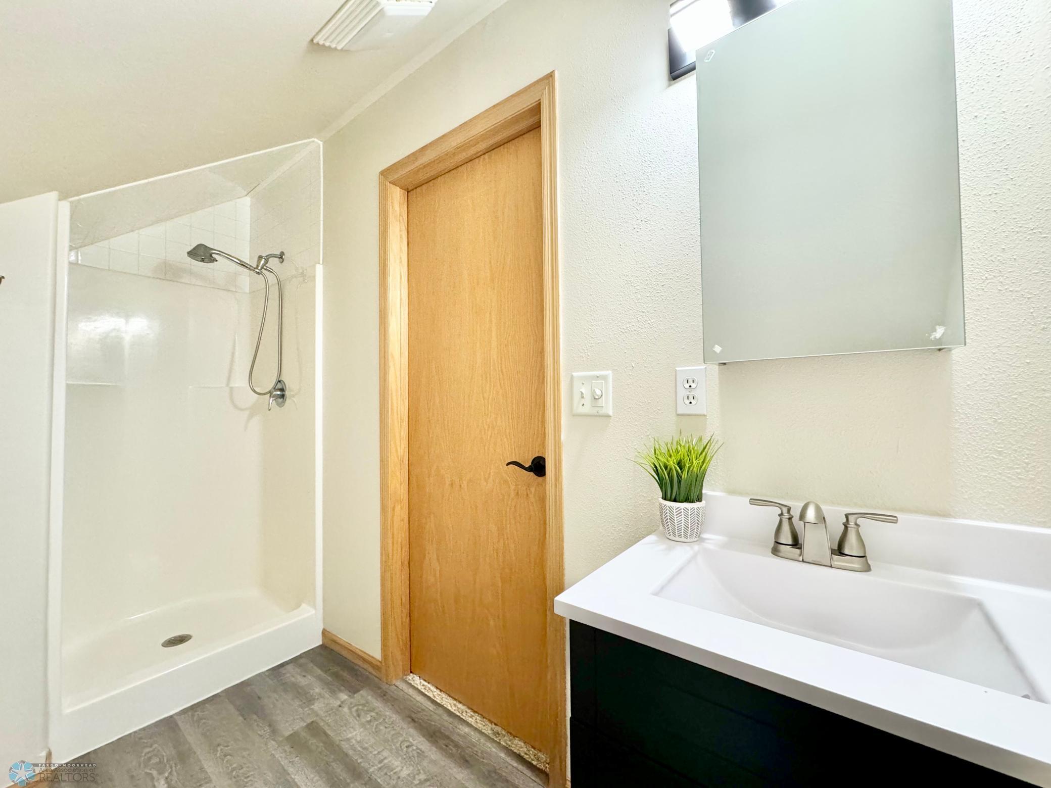 2nd floor bath, brand new vanity, lighting, floors