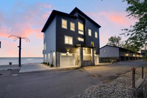 Parking area along the side of the house and high end lighting