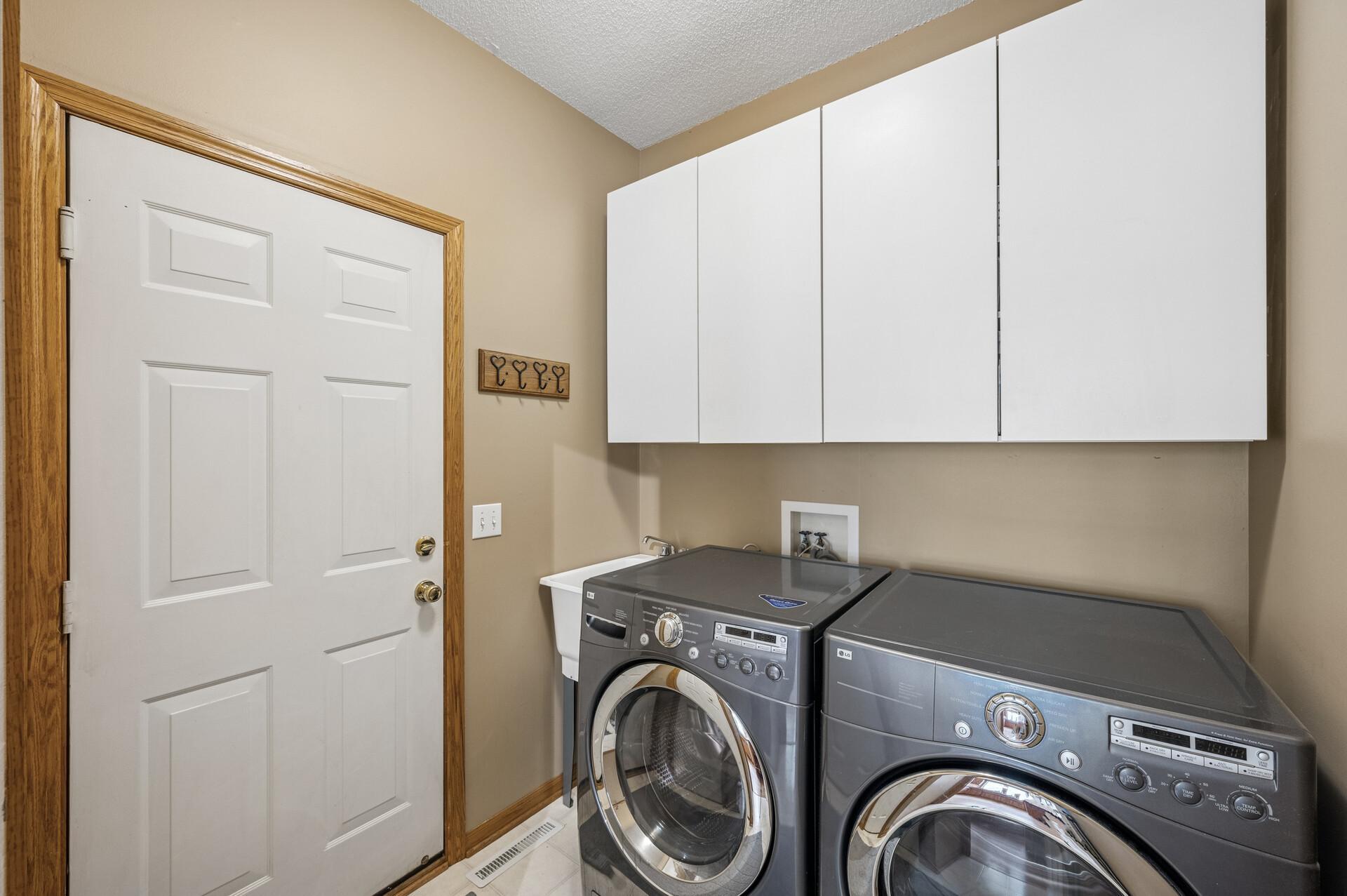 Main floor laundry also serves as a mudroom-right inside garage for convenience