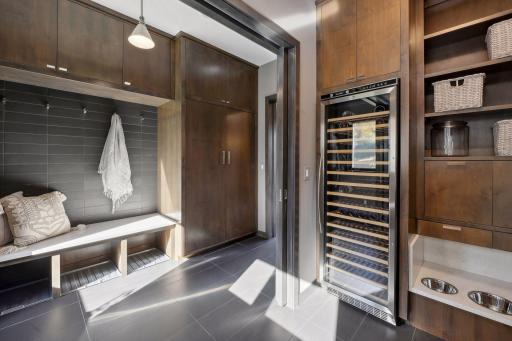 Laundry room additional storage and pocket doors.