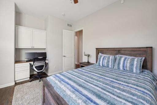 Main floor bedroom with built in desk.