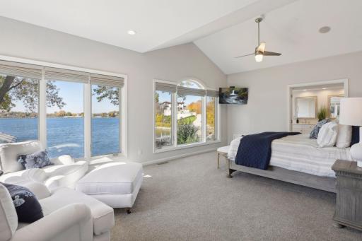 Primary bedroom enjoys vaulted ceiling, extra wide door to the ensuite and incredible views.