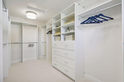 Discover ample storage in the spacious primary walk-in closet.
