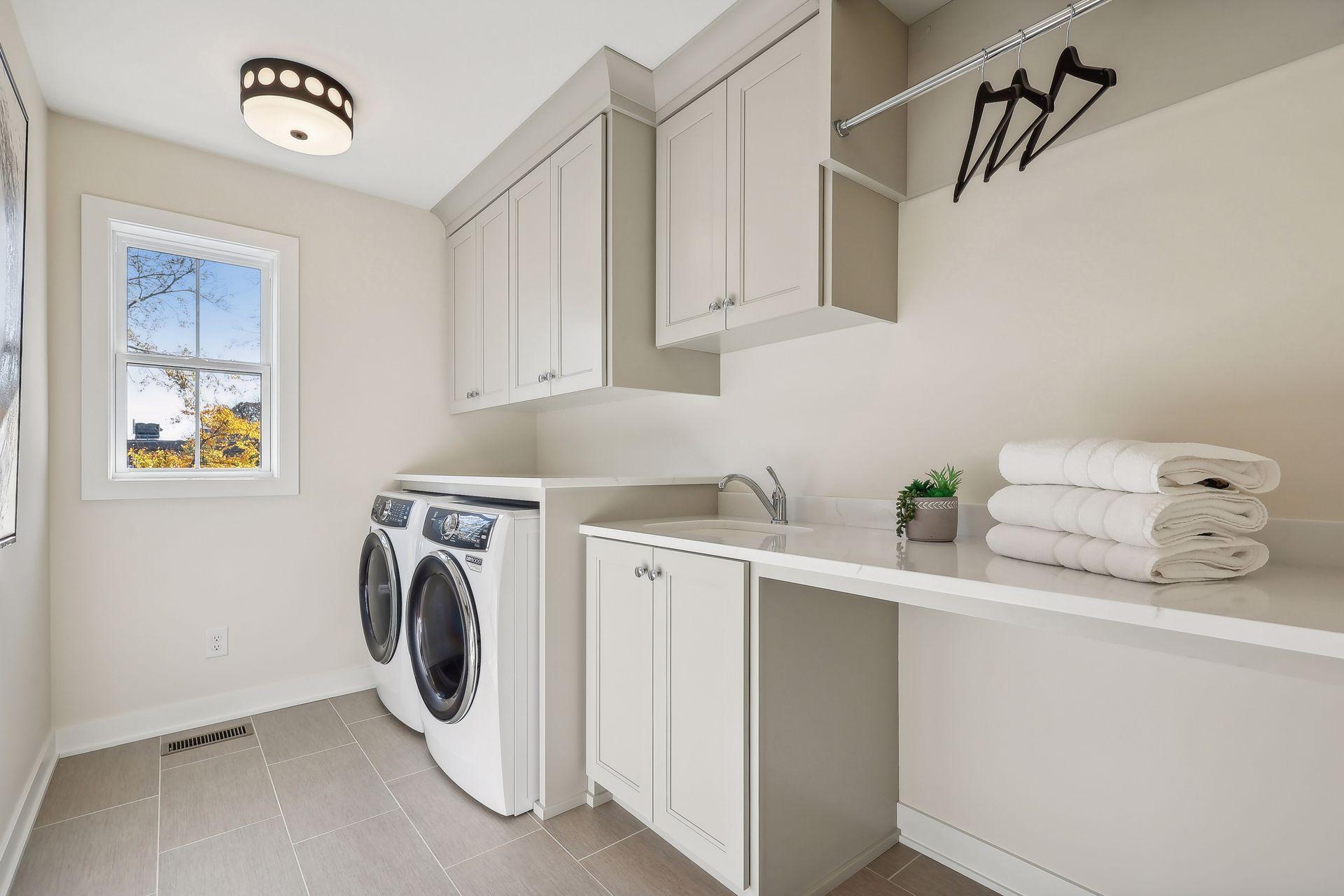 Enjoy the convenience of the upper-level laundry room, designed for easy access and efficiency.