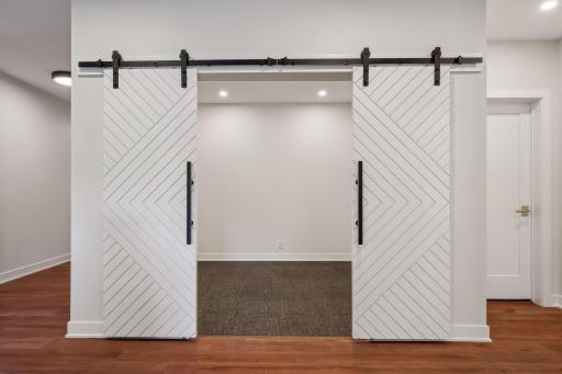 Enter the exercise room through two stylish sliding barn doors.