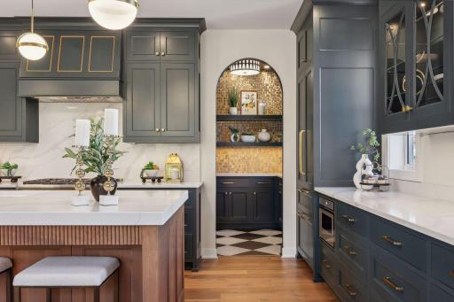 Discover the convenience of a walk-in pantry just off the kitchen, offering ample storage and easy access to all your essentials