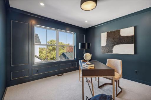 Admire the study room's elegant molding accent on the window wall, adding a touch of sophistication. Could also be used as a 4th bedroom on the upper level