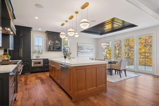 Effortlessly entertain as you move from the kitchen to the conveniently adjacent dining room