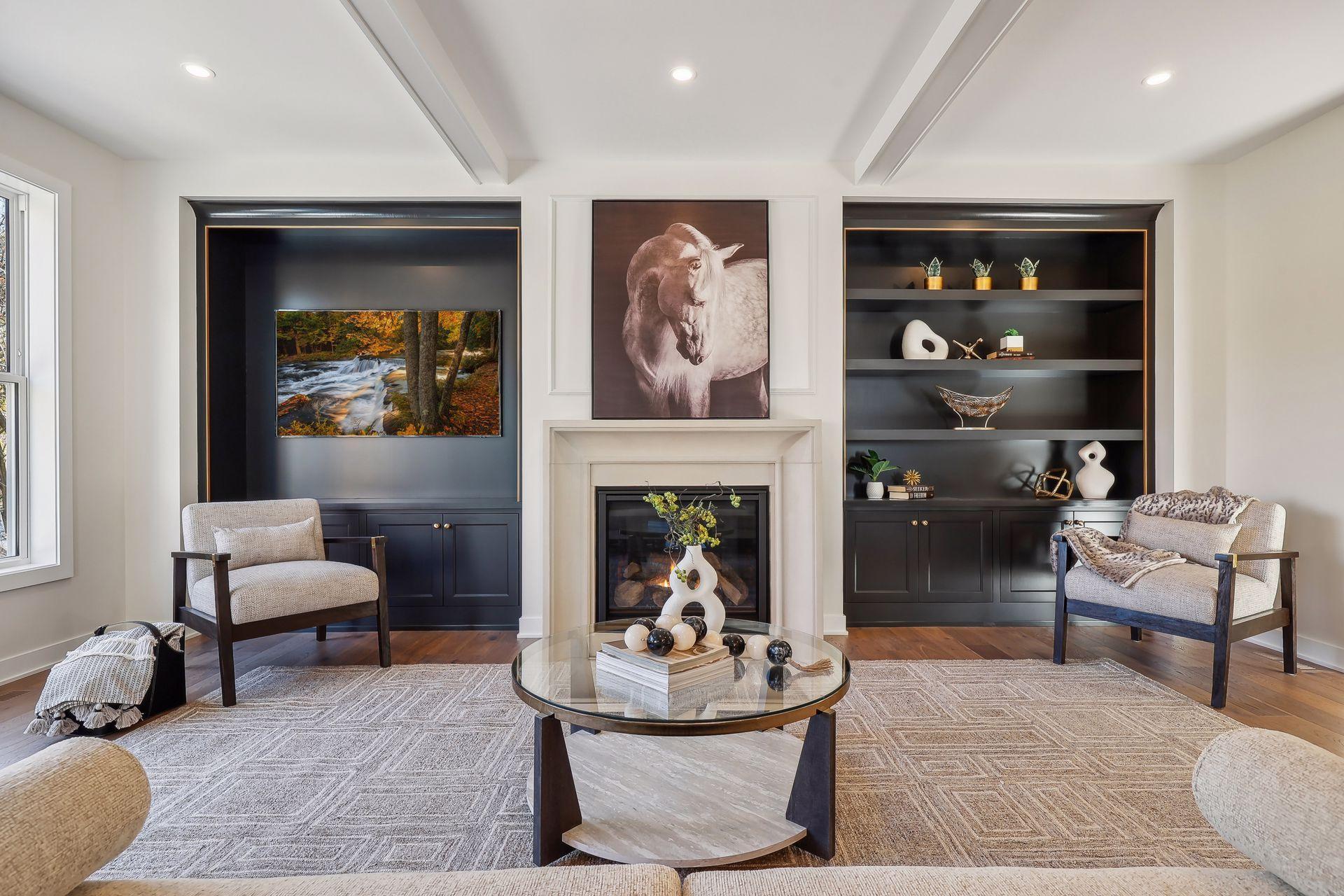 The great room, featuring a striking limestone surround fireplace and sleek black slip-in style built-ins.