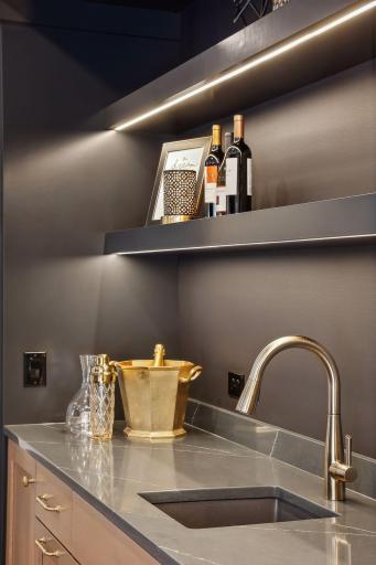 Under shelf lighting to illuminate the lower level bar.