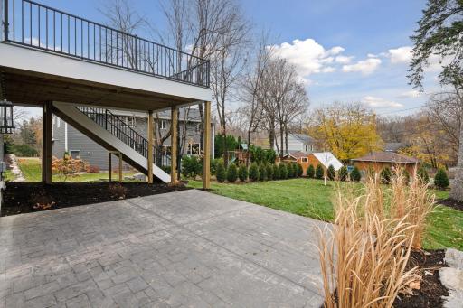 Step into relaxation on this inviting walk-out patio, perfect for enjoying serene moments and outdoor gatherings