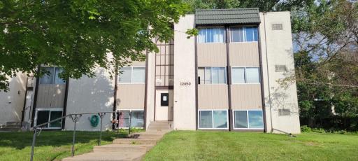 Front of building, this is one of the best locations in the complex. It's across the parking lot from the gym and pool areas. It's tucked away in private, yet easily accessible area of the community