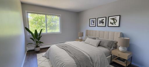(Virtually staged) - Bedroom window lets in nice lighting and treetop views.