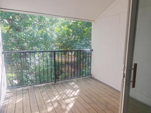 Great covered deck off of living room. Courtyard views, lots of trees. Beautiful to enjoy at any time of year.