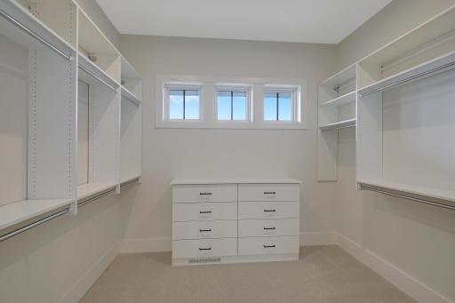 Space, organization and natural light highlight the master walk-in closet.