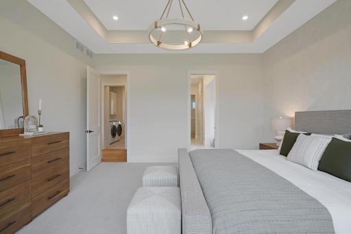 A view in the master bedroom to the bath, hallway and laundry room.