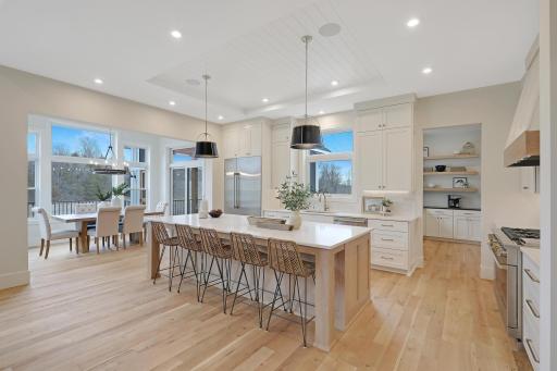 A view of the kitchen, dining area, butler's pantry, porch and deck.