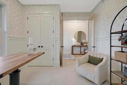 Located right off the foyer, the office features 8-foot tall french doors.