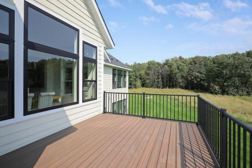 This spacious, maintenance-free deck is made with high-quality, weather-resistant materials, offering a durable outdoor space perfect for dining, lounging, and entertaining without the hassle of upkeep.