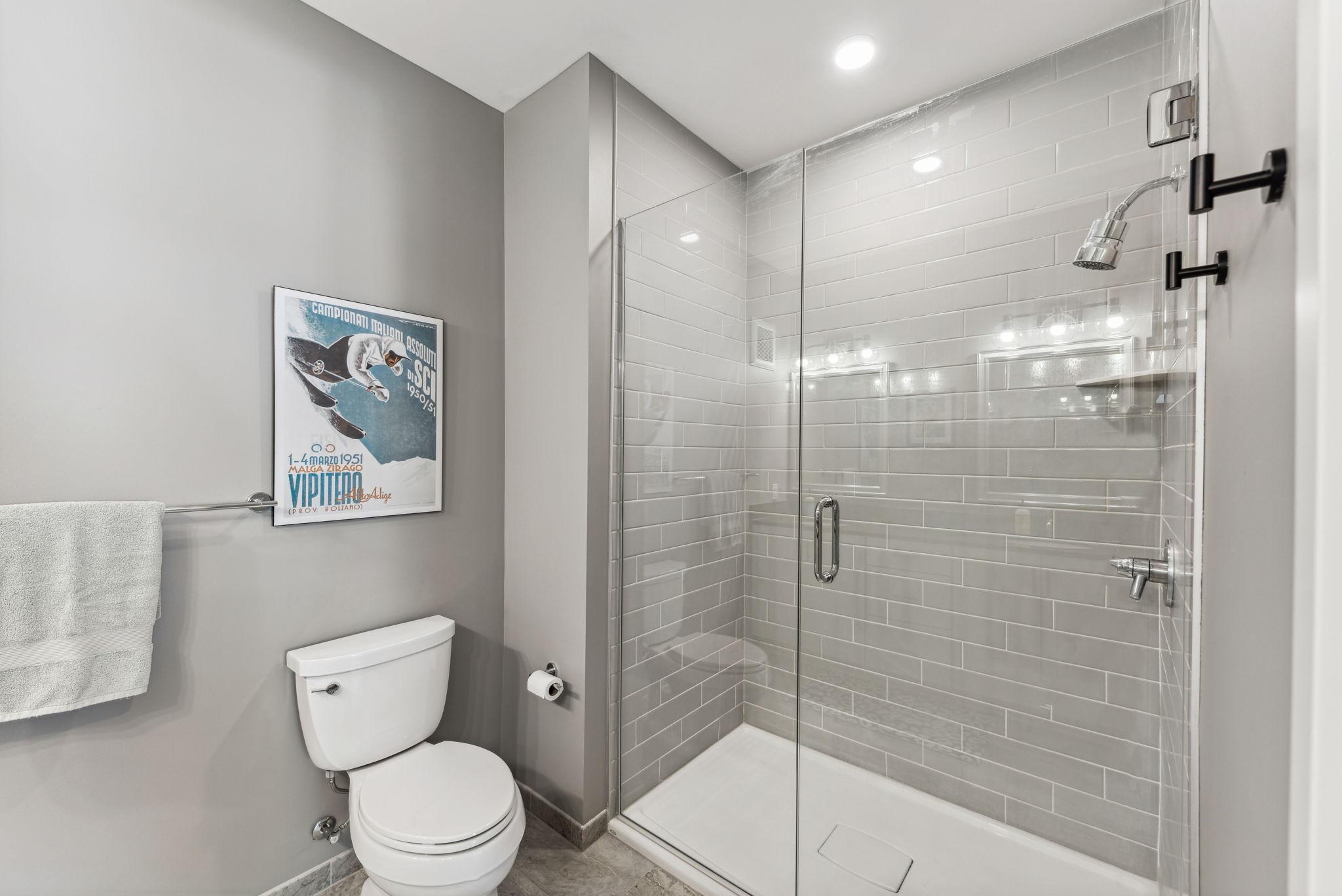 Lovely tilework and modern shower.