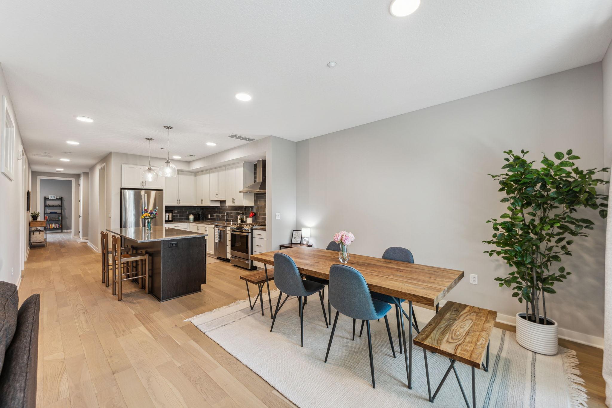 Living and Dining areas with gorgeous high -end Shaw® engineered wood flooring.