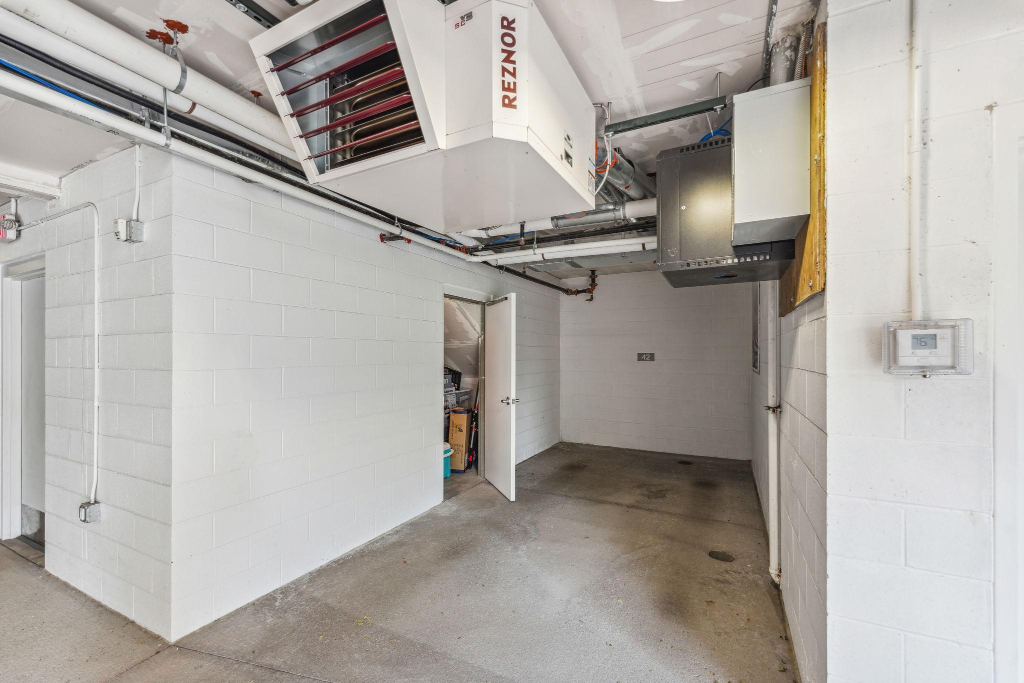 Safe, private parking garage well lit with convenient storage room for your extra items.