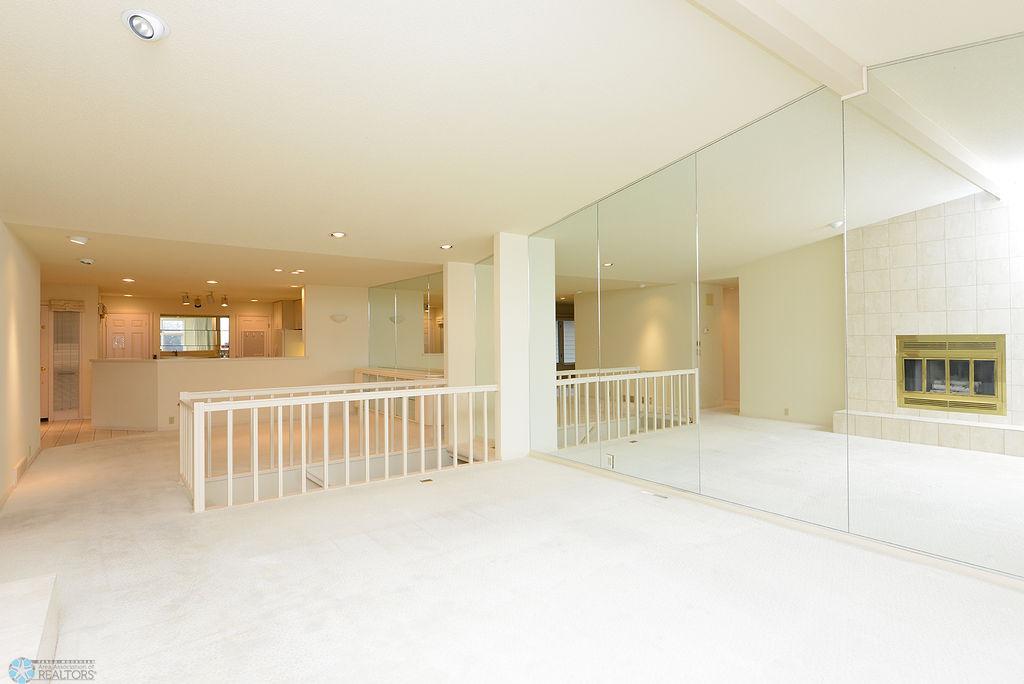 Living Room With Mirrored Wall