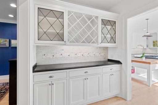 The butler's pantry with exquisite tile work and cabinetry.