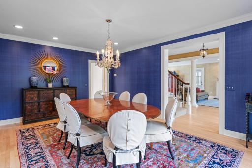 A view from the dining room to the entry hall and living room.