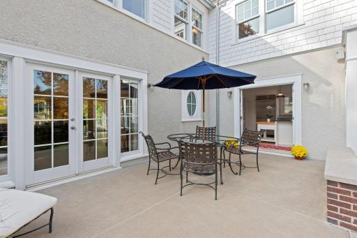 A view from the rear terrace into the kitchen and living room.
