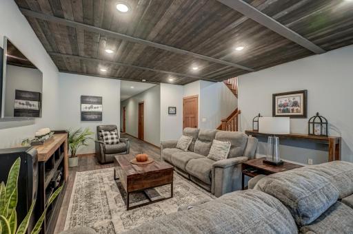 Retreat to the walkout lower level to find rustic wood accents throughout the expansive living and entertaining area, hobby rooms, and excellent storage space.