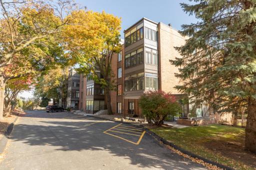 Nestled into Trees on this Top Floor Corner!