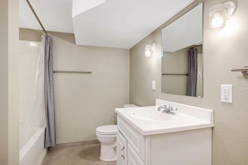 A fresh full bath in the lower level completes the space.