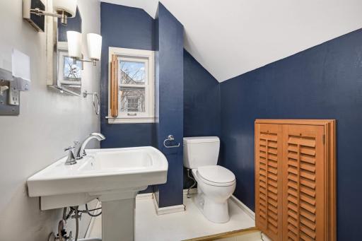 Upper level 1/2 bath conveniently located to the two upper level bedrooms and flex space.