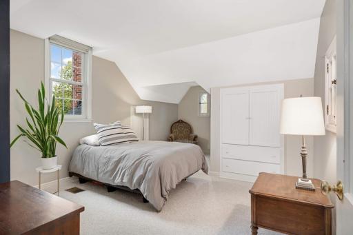 Upper level bedroom features great built in storage.