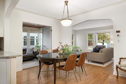Step inside to discover gleaming hardwood floors, graceful arched doorways, and abundant natural light.