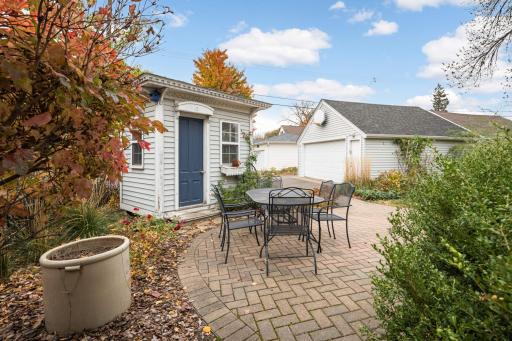 Outside, a detached 2-car garage completes the picture-perfect backyard oasis.