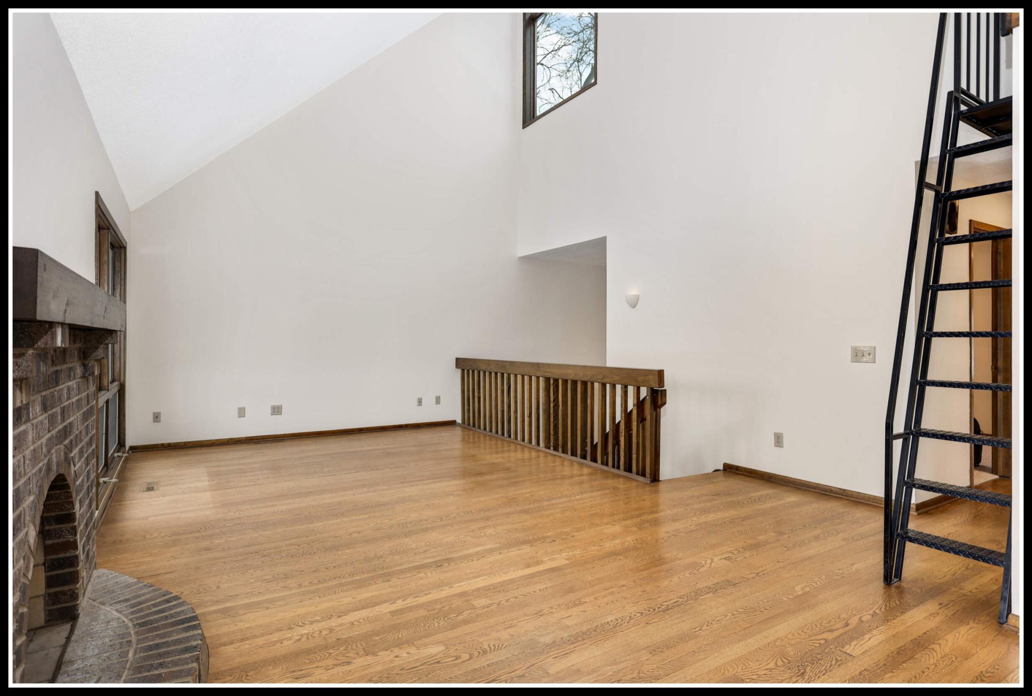 Vaulted ceilings and second story windows give the upper level a bright, open, and airy feel