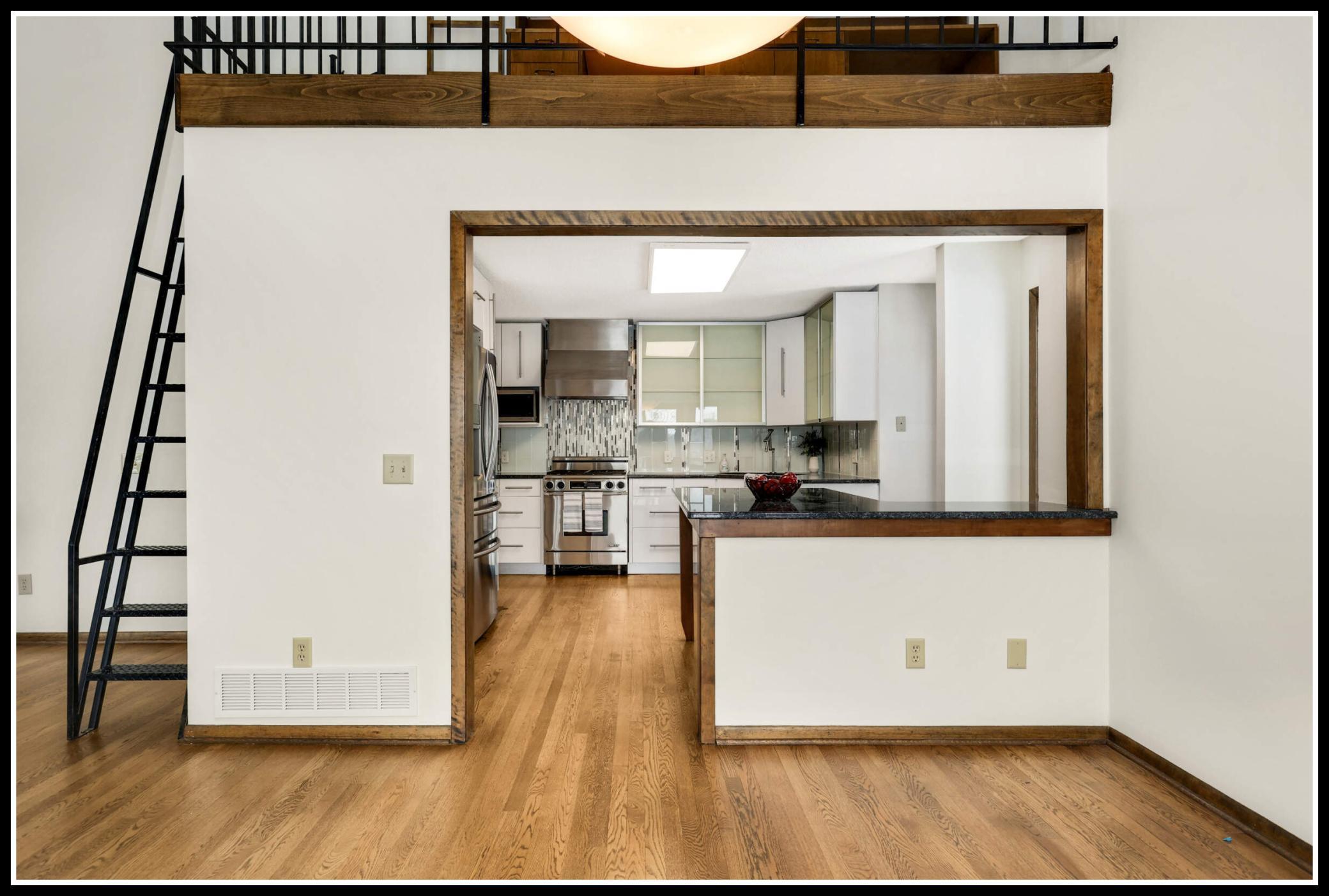 The fully updated kitchen opens to the dining room