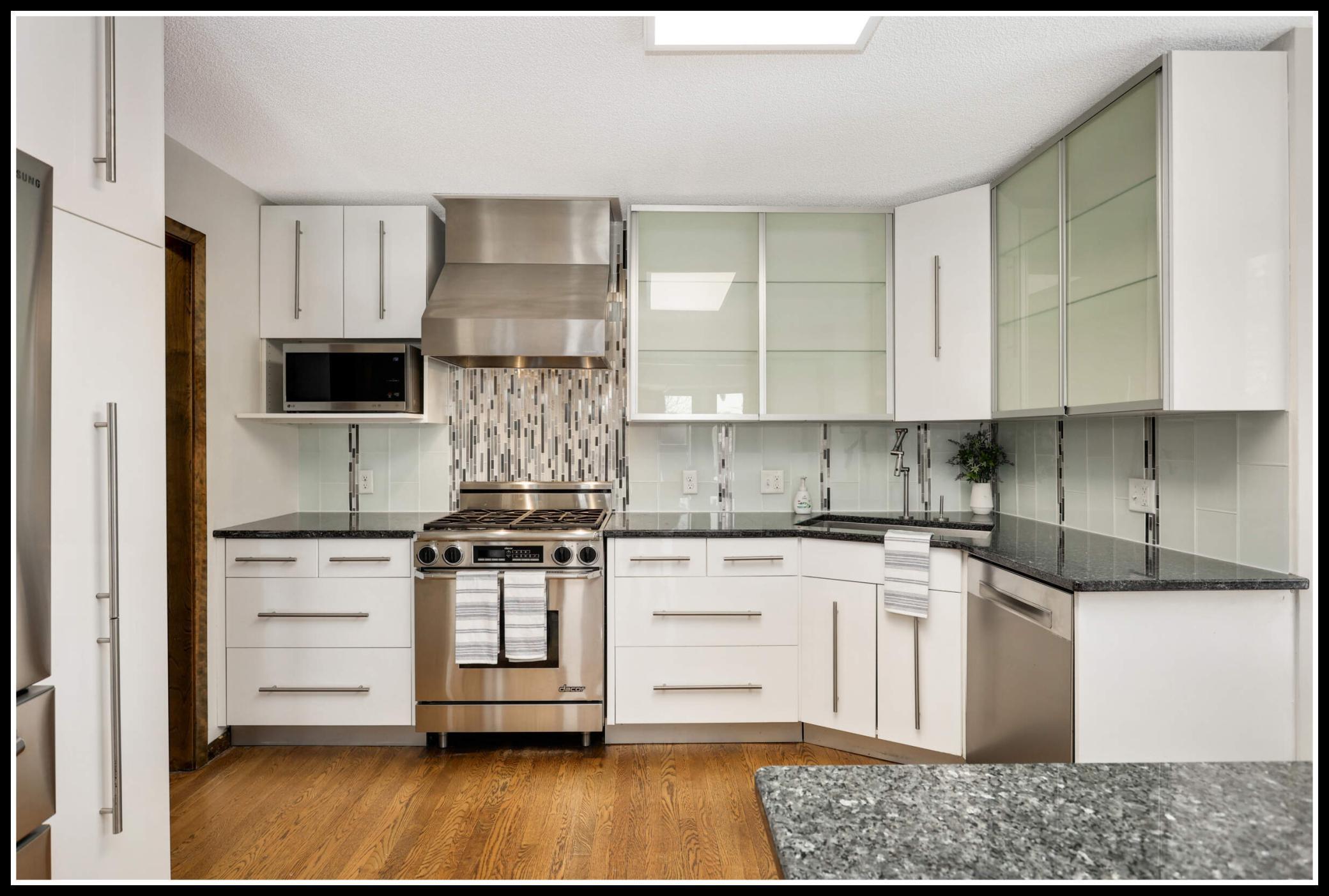 All new glossy white cabinets with frosted glass uppers