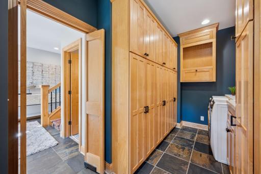 Mudroom features laundry and several lockers for storage conveniently located off the attached garage.