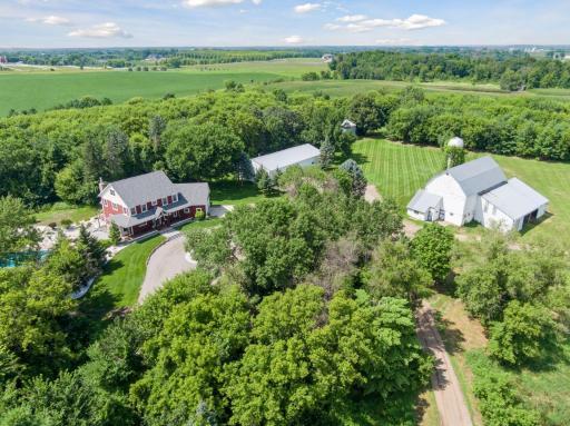 Gorgeous 64 acre parcel with modern day farmhouse, swimming pool and outbuildings with development opportunities in the City of Greenfield. Close to several private schools and just minutes to Plymouth!
