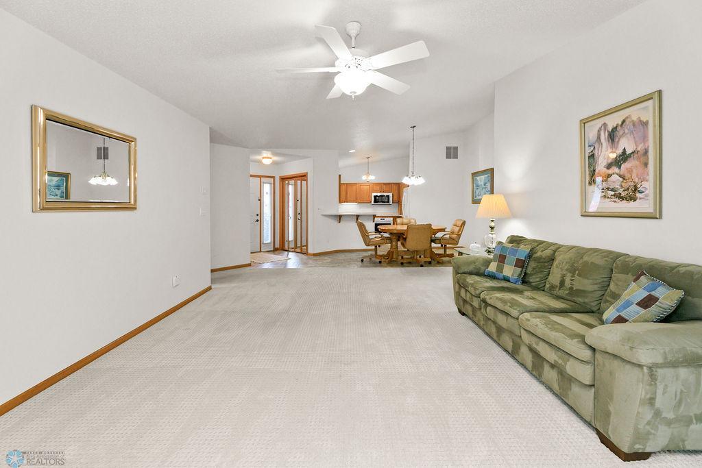 Living Room looking to Entry, Kitchen & Dining.