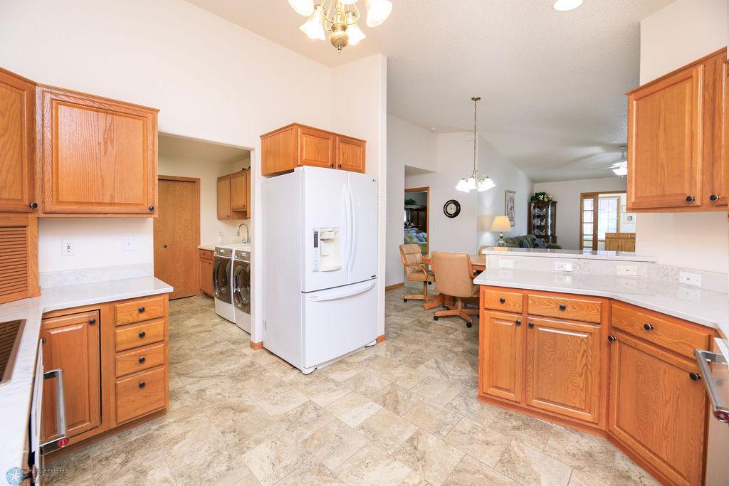 Kitchen. Breakfast bar peninsula looks out to Dining & Living Room