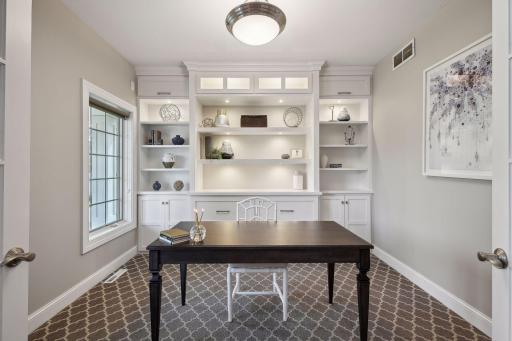 Custom built cabinetry with accent lighting gives this room an elegant look.