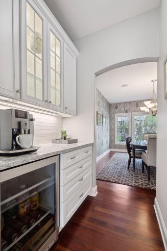 The butler's pantry area is a great space for morning coffee or a drink & appetizer service station. Conveniently connects the kitchen and dining room.