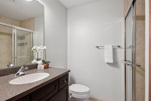 The en suite bathroom features a full size shower.